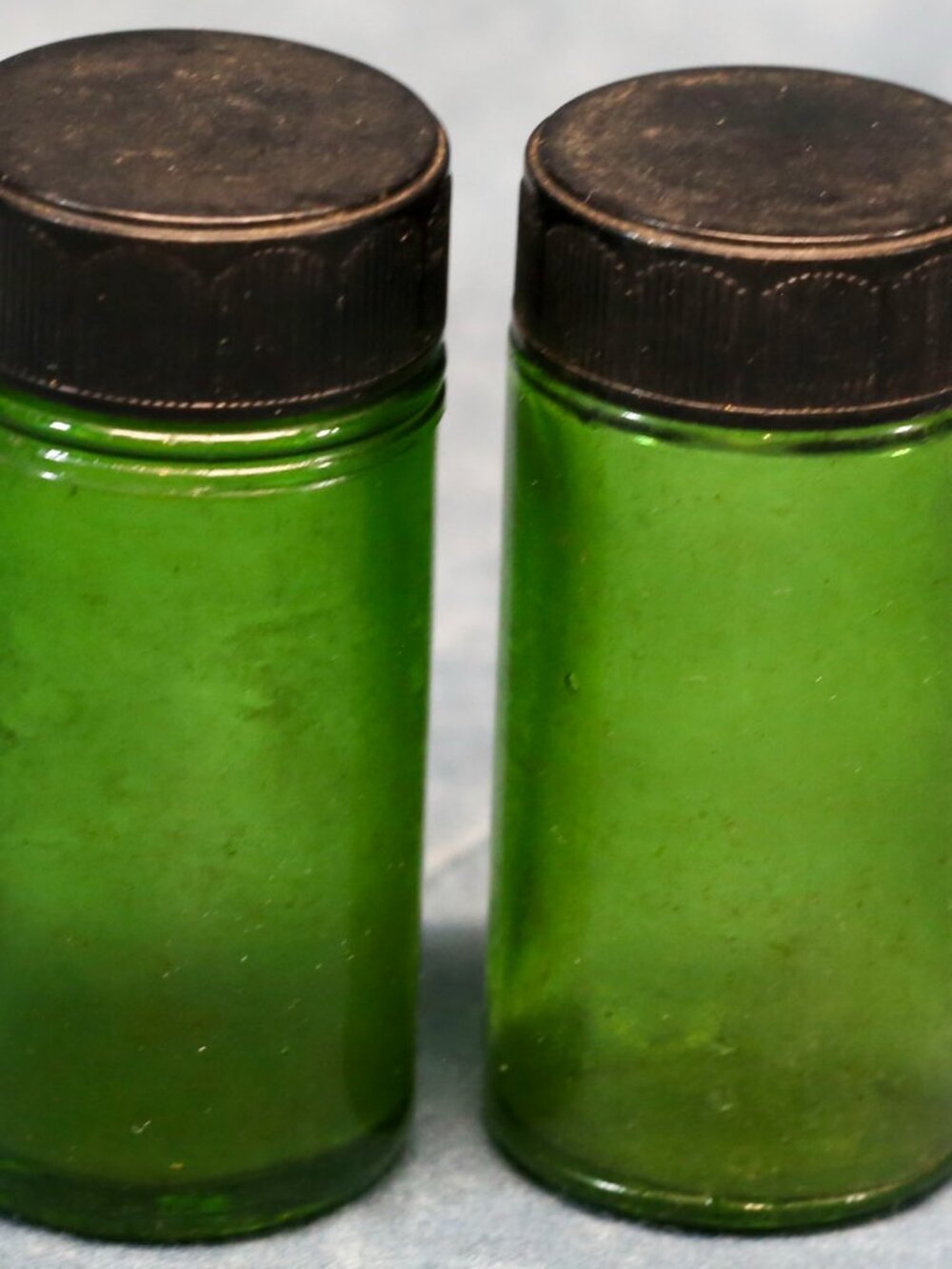 Vintage Green Glass Pill type bottles with inscriptions.  1 oz.